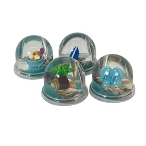 Figurină decorativă glob transparent cu tematică marină, disponibilă în mai multe modele