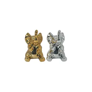 Figurină decorativă elefant ceramic, model așezat, finisaj lucios auriu și alb,  decor casă și birou